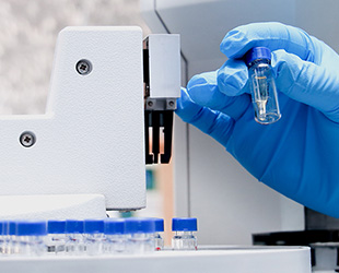 Scientist handling gas chromatography samples